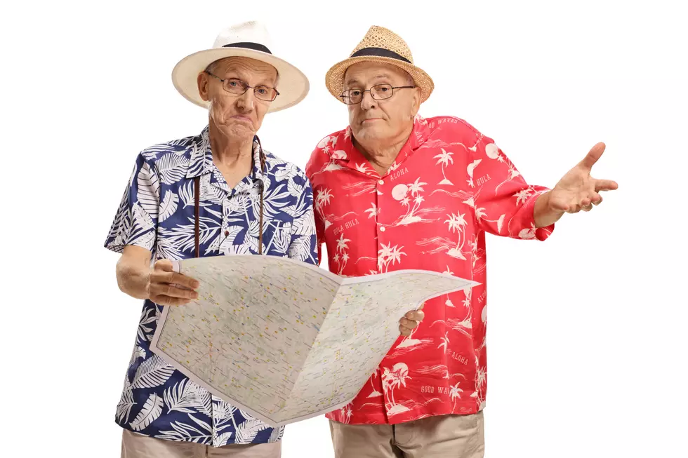 Lost elderly tourists with a map