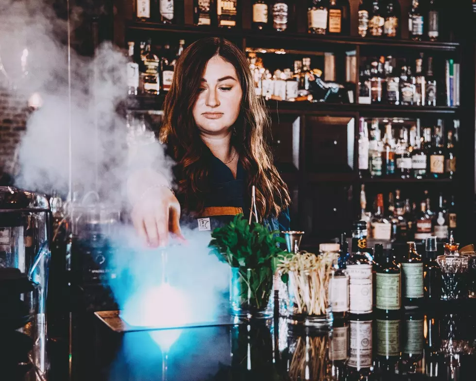 a bartender making a cocktail in the farmer's cellar in lakeville, mn