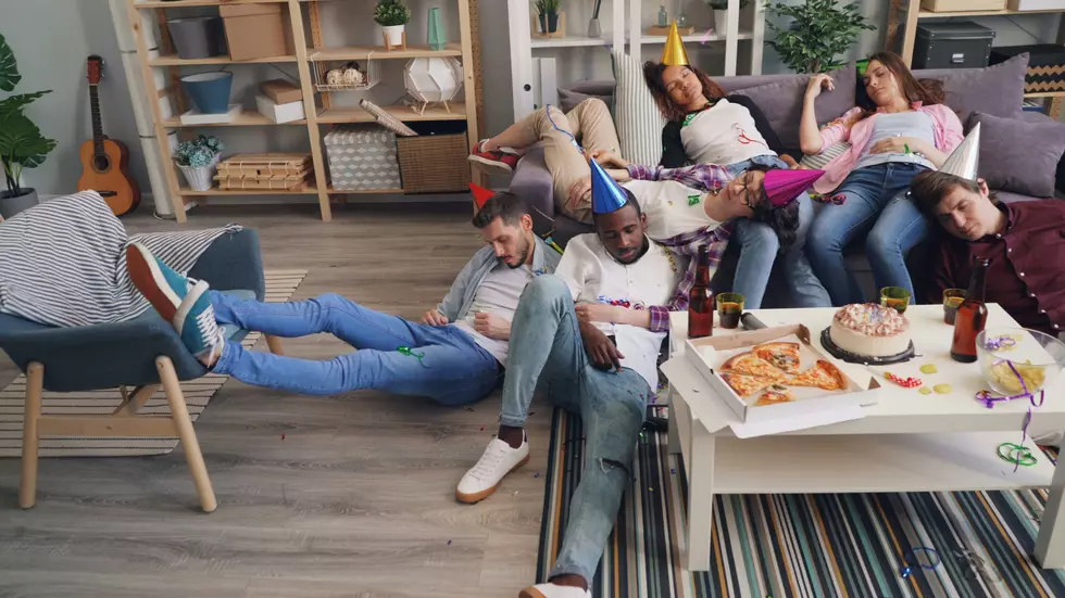 a group of people asleep wearing party hats