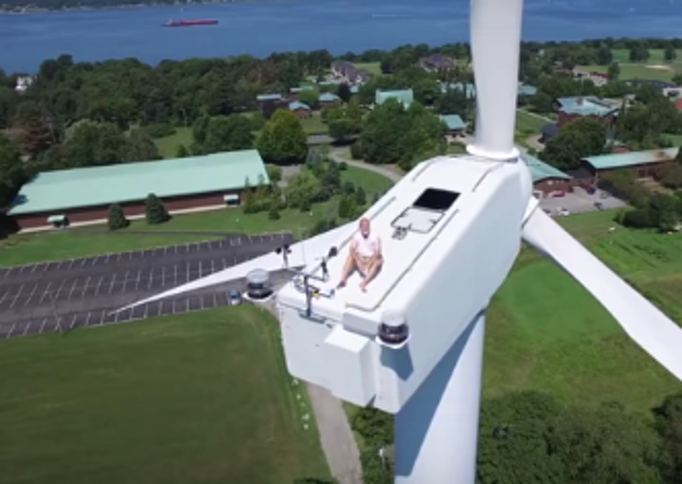 Drone Captures Man Sunbathing on Top of Wind Turbine – [Video]