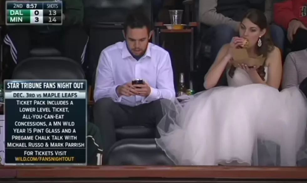 Big Wild Fan Heads to Hockey Game… In Her Wedding Dress