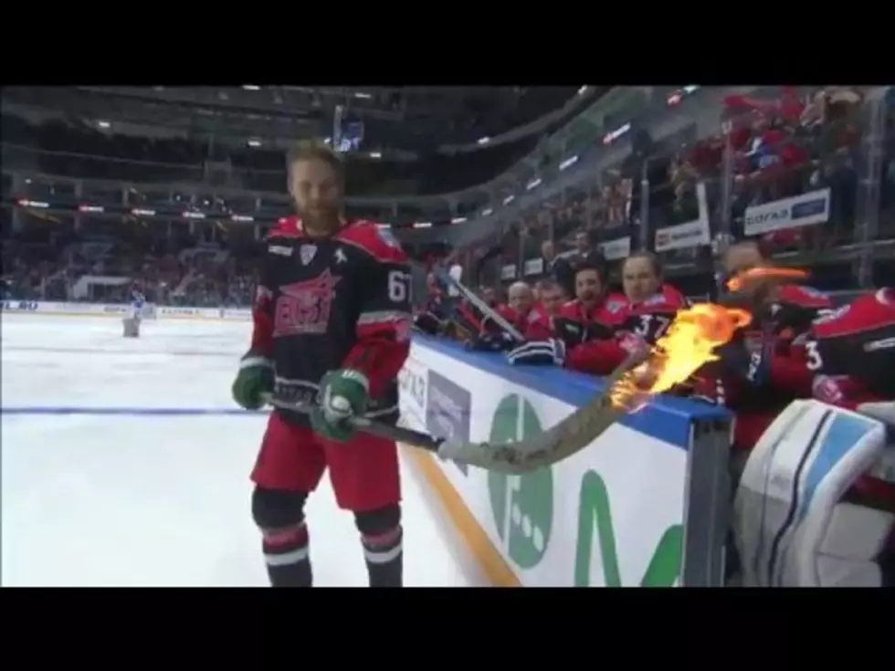 Hockey Player Attempts To Score With Flaming Stick