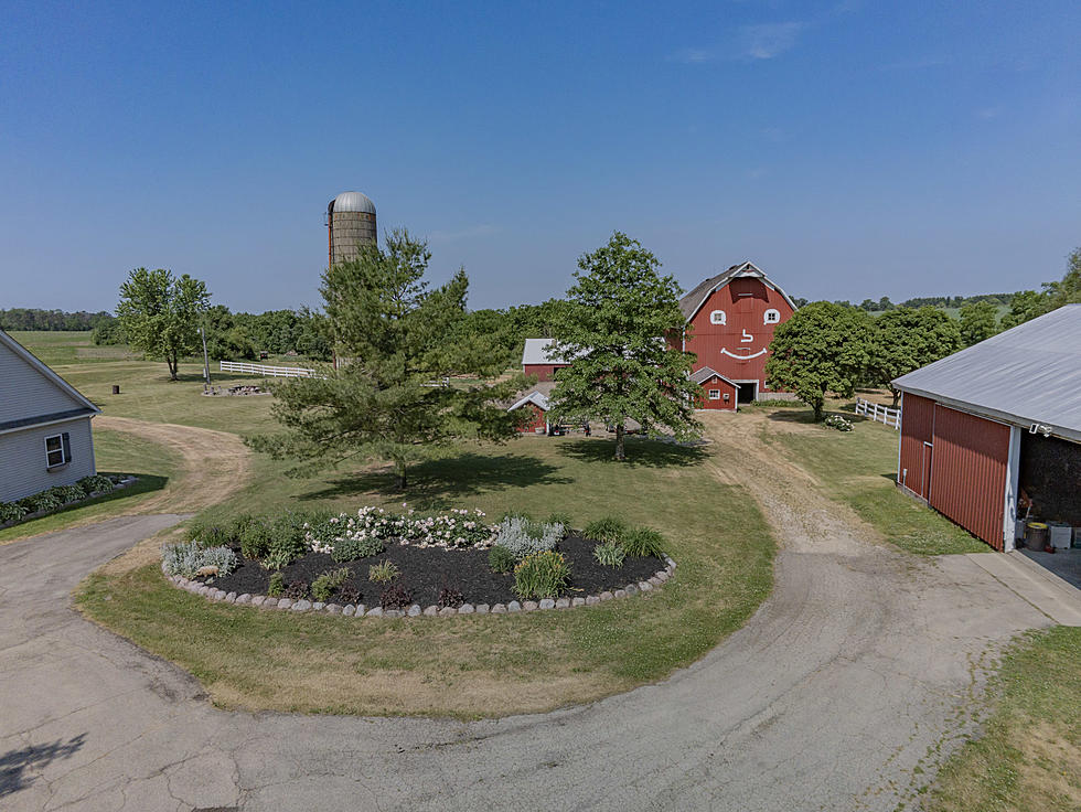 This Farmhouse For Sale in Pecatonica Has a Huge Smiley Face Barn