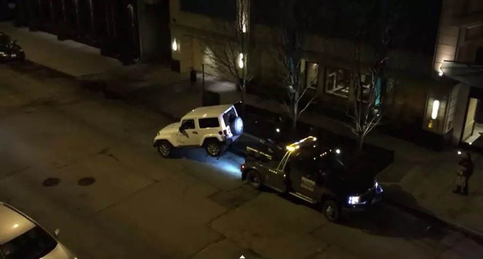 Chicago Driver Escapes Tow Truck by Driving Away