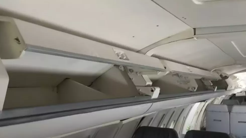 There is a private jet left abandoned off of a highway in Illinois.