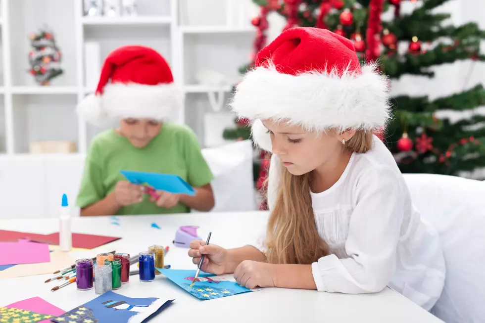 Kids making christmas greeting cards