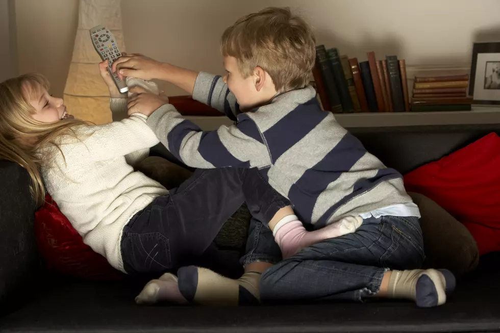 Brother And Sister Fighting Over Remote Control