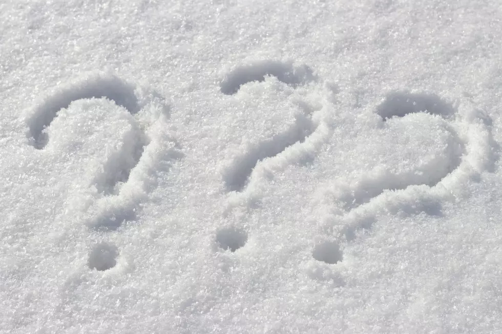Question mark on white snow, close up, copy space