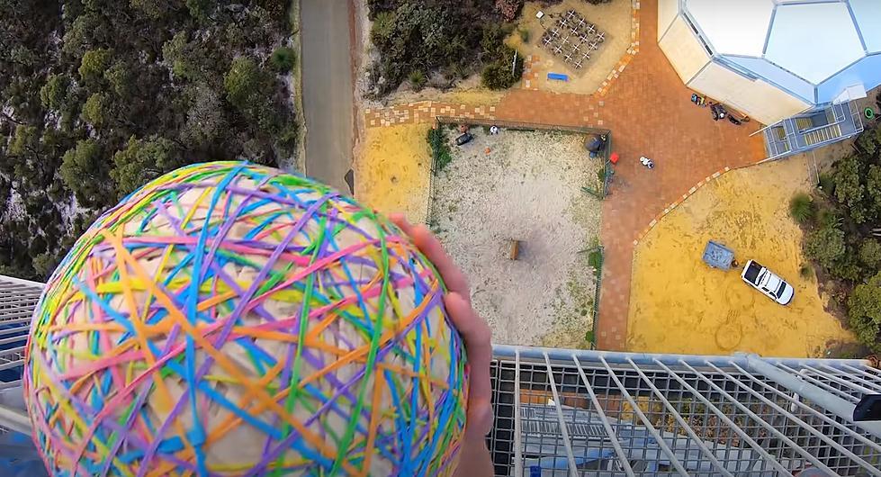 Giant Rubber Band Ball vs. Giant Ax Blade (video)