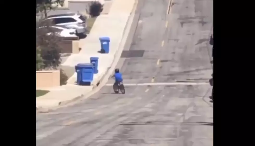 Kid on Bike Crashes into Garbage Bins to the Drumbeat of &#8216;In the Air Tonight&#8217;