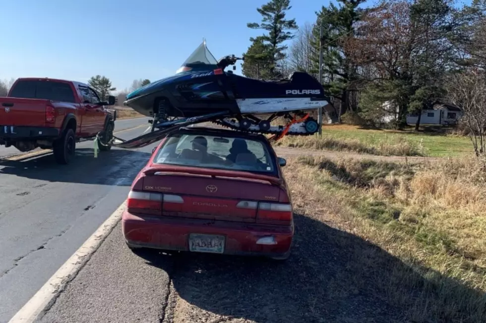 Trooper Pulls Over A Car With a Snowmobile on the Roof