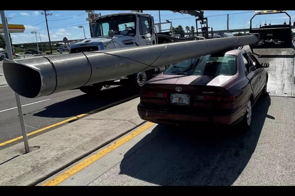 Florida Man Straps Utility Pole to Roof of Car (Photos)