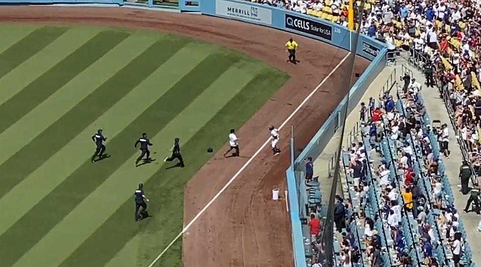 Fan Runs Onto Field at Dodger Stadium, Ball Girl Tosses Him Into