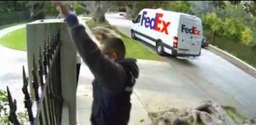 Delivery Guy Throws Computer Monitor Over A Fence [VIDEO]