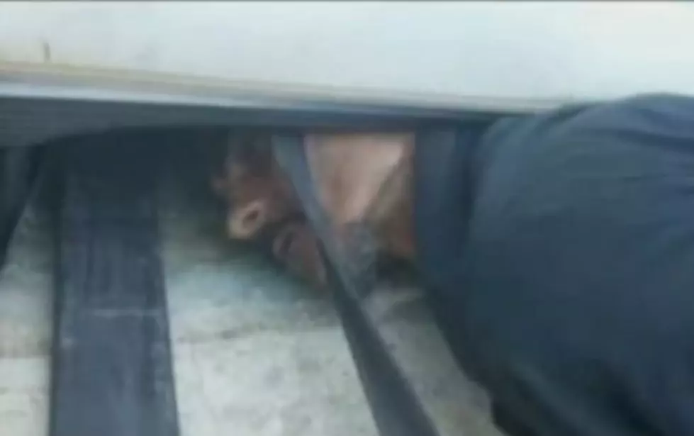 Would Be Thief Gets Stuck Under Garage Door of Business He’s Trying to Rob [VIDEO]