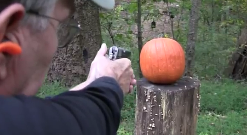 Guy Carves Pumpkin Using a Gun