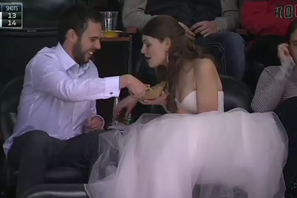 Wedding Dress-Wearin’, Burger-Eatin’ Woman at NHL Game Is the Ultimate Fan