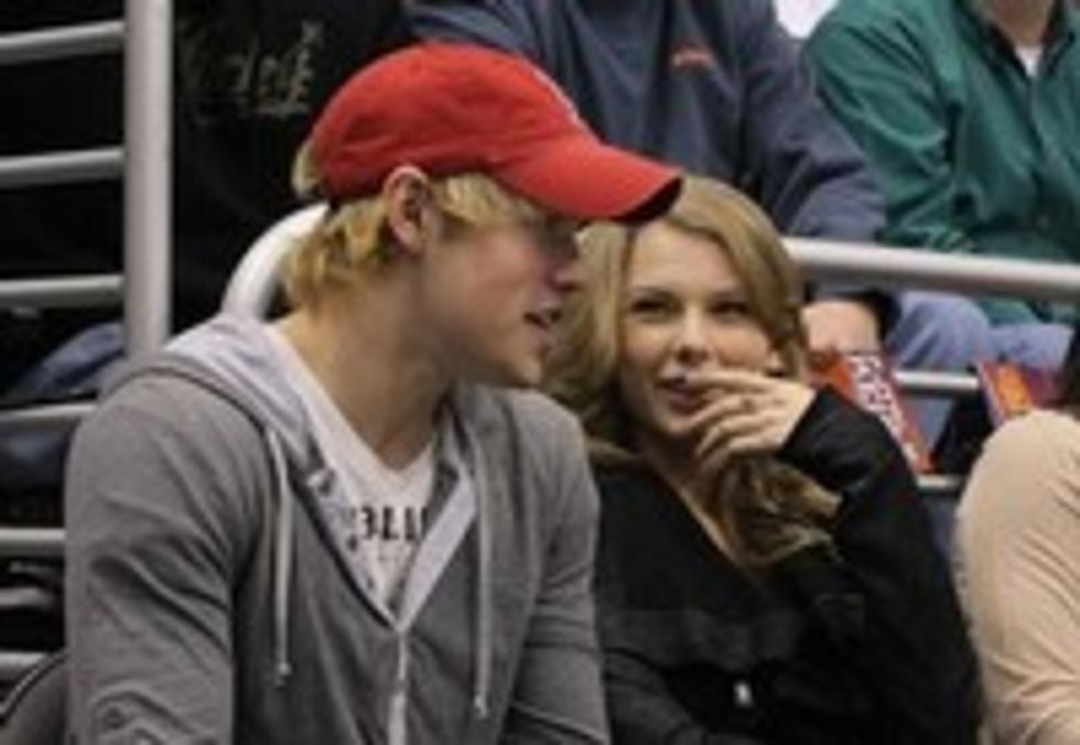 Taylor Swift and Chord Overstreet at NBA Game