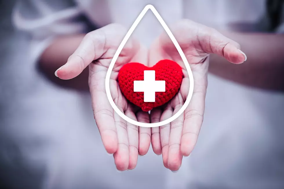 hand giving red heart for help blood donation hospital or healthcare concept.