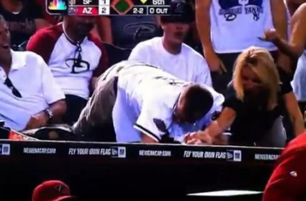 Diamondbacks Fan Takes Foul Ball From Woman [VIDEO]