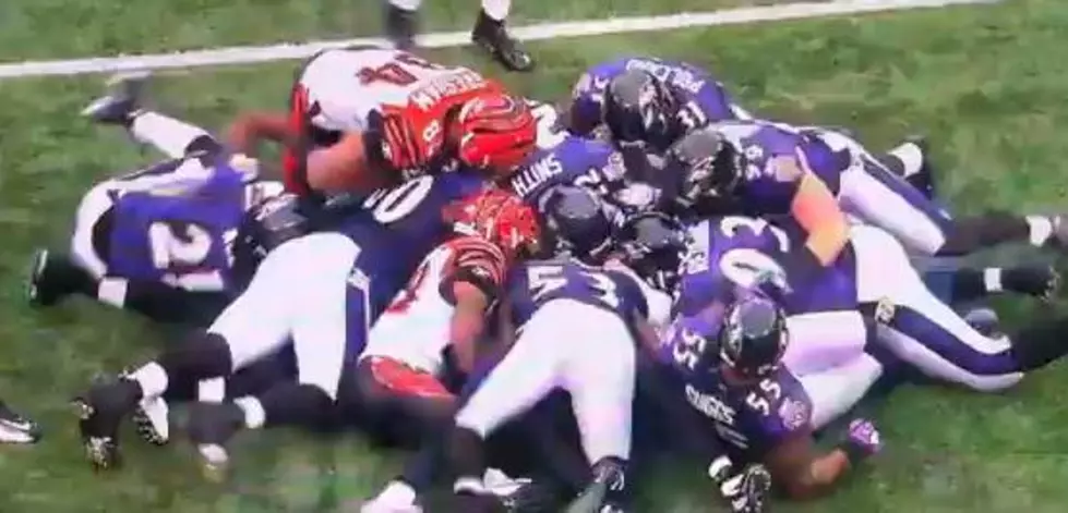 Referee Buried Under Football Players [VIDEO]