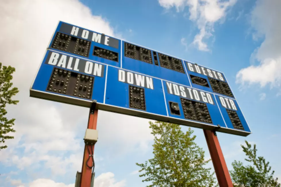 a football scoreboard / ball on down and yards to go / home guests and quarter