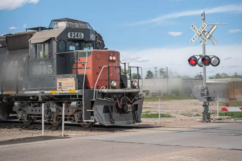 Watch Pedestrian Cheat Death by Seconds on Railroad Tracks