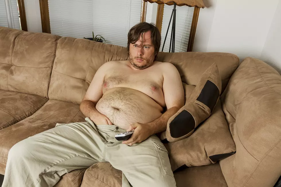 fat guy laying on the couch