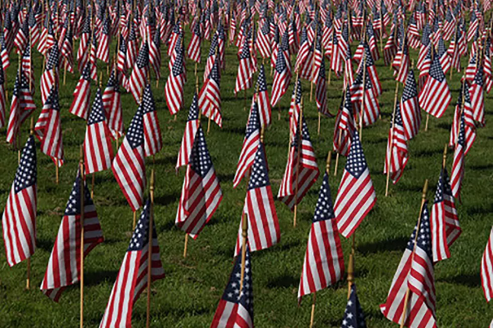 Volunteer To Place Flags For Vets For Memorial Day