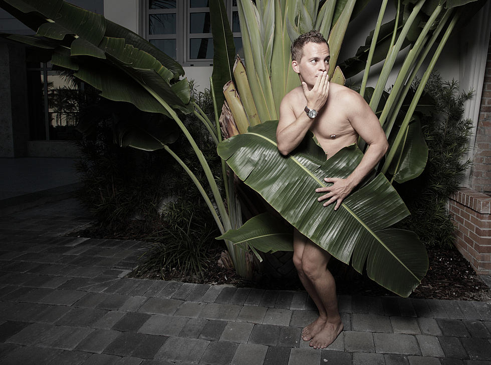 Man covered by a leaf