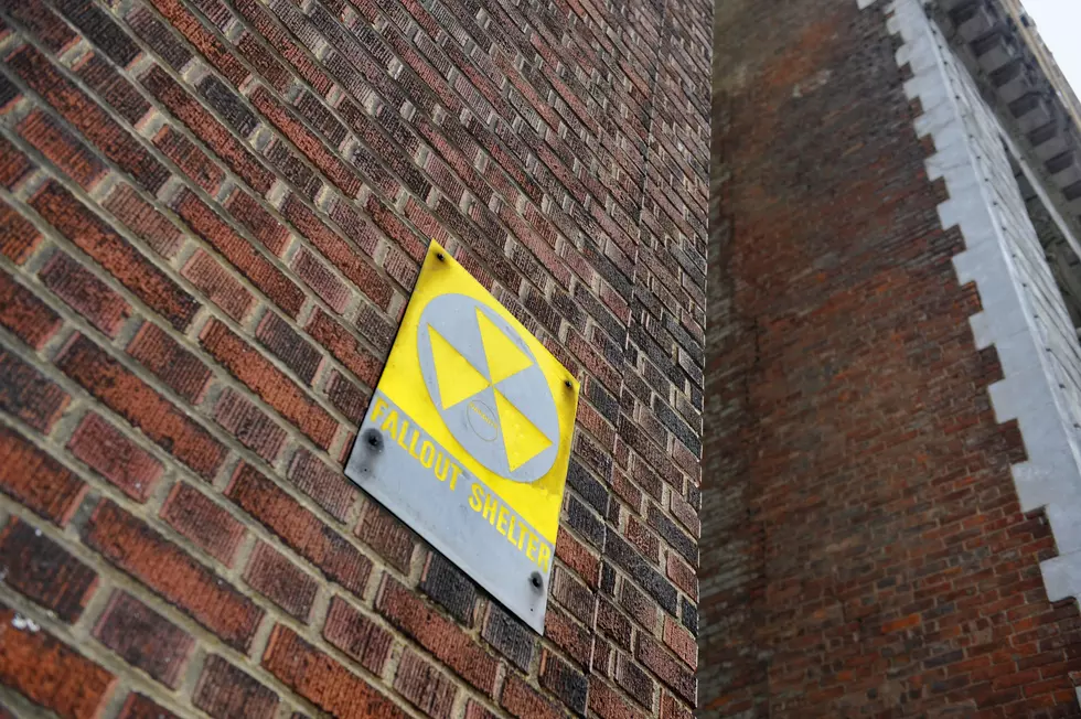 Fallout Shelter Sign on Red Brick Wall