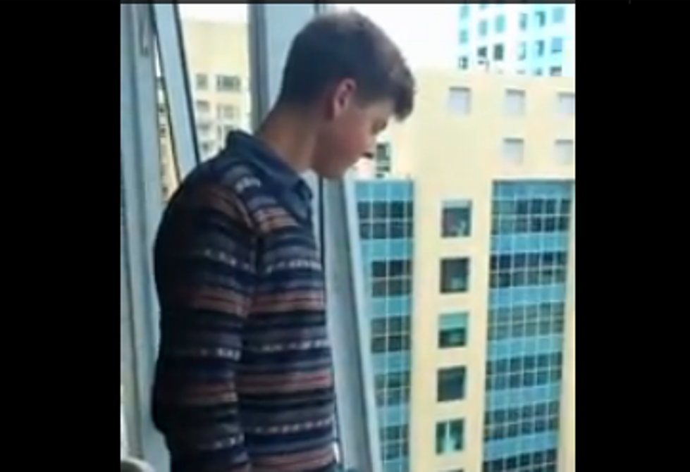 Justin Bieber Clone Taunts Female Fans From Hotel Window [VIDEO]