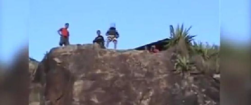 Dude Runs Off Cliff With Bucket On Head And Lives [VIDEO]