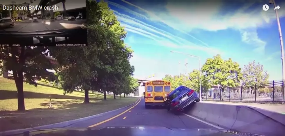 BMW Driver Drives on Guard Rail Trying to Pass School Bus in Albany [VIDEO]