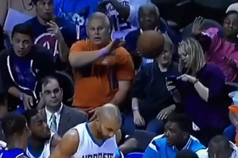 Inattentive Fan Focused on Phone Gets Drilled by Basketball