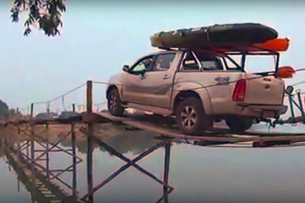 Watch This Truck Crossing a Narrow, Rickety Wooden Bridge