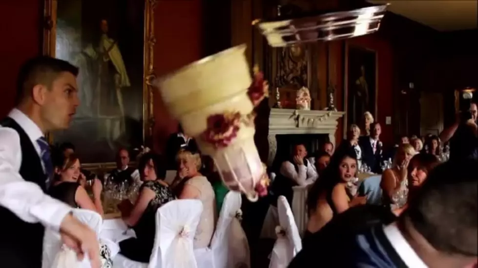 Groom Pranks Bride By Dropping Wedding Cake [VIDEO]