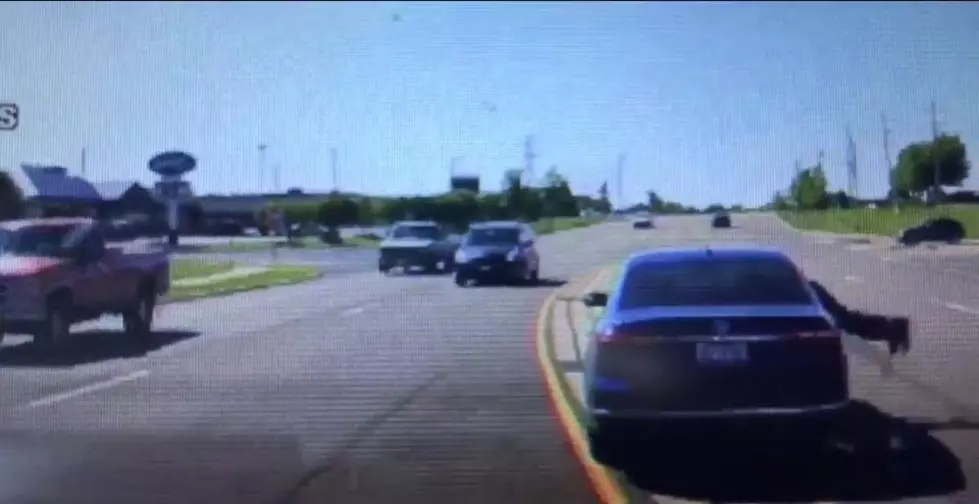 Guy Dives Through Window of Moving Car to Save Driver [VIDEO]