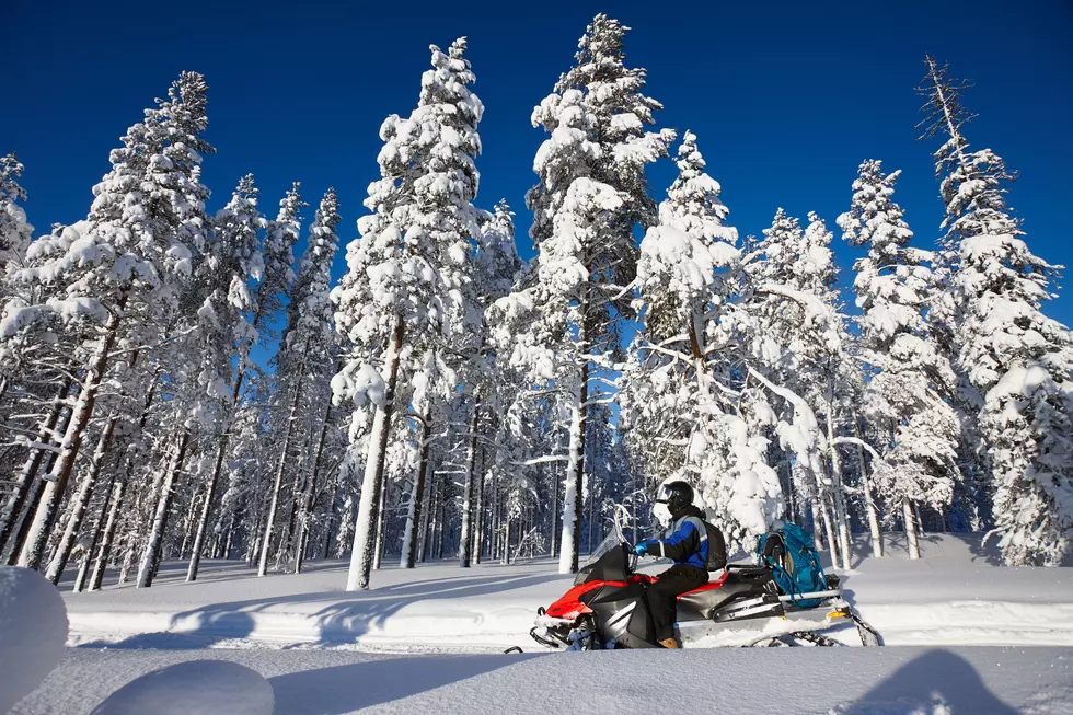 Man driving snowmobile in Finland
