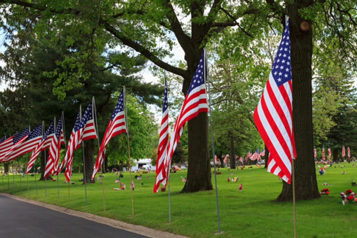 Volunteer to Place Flags at Saratoga National Cemetery
