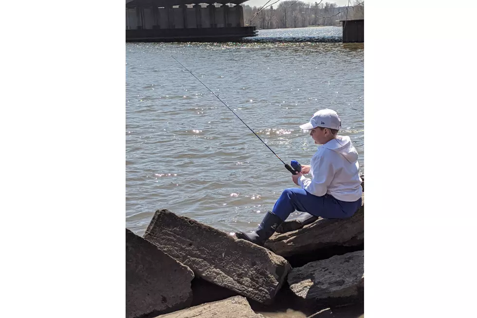 Chrissy Cheers on Son While Fishing