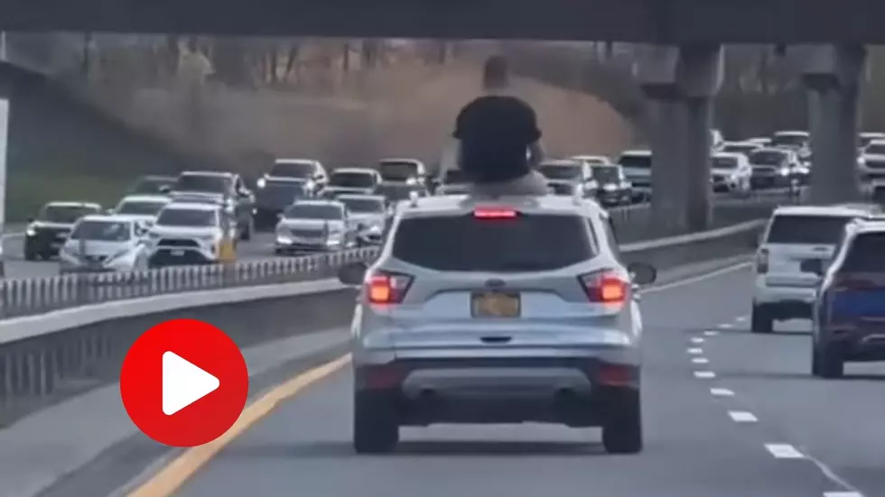 Insane Vid Shows Man On Top of Fast-Moving Car on The Northway