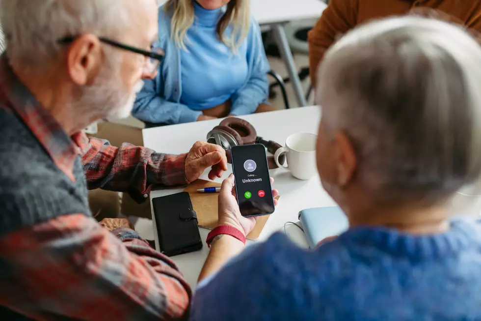 Elderly folks looking at an unknown number calling them