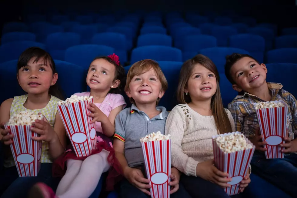 A group of kids watching a movie