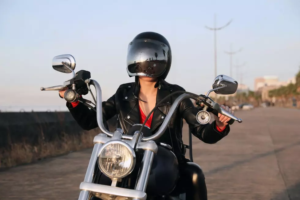A woman riding a motorcycle