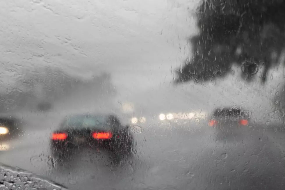 A POV of a rainy windshield in a car