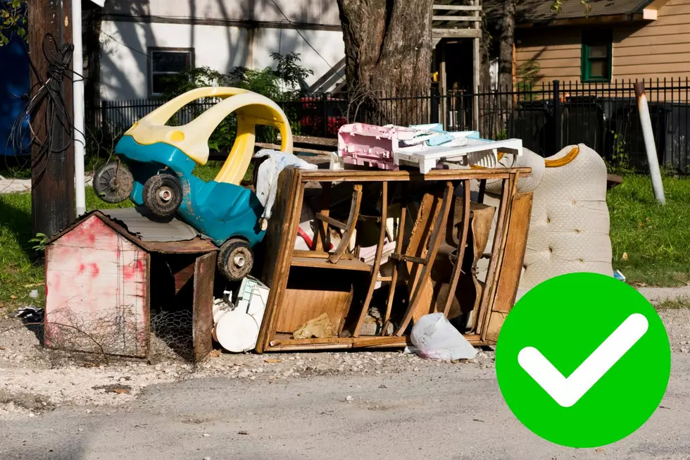 A pile of bulk trash with a checkmark next to it