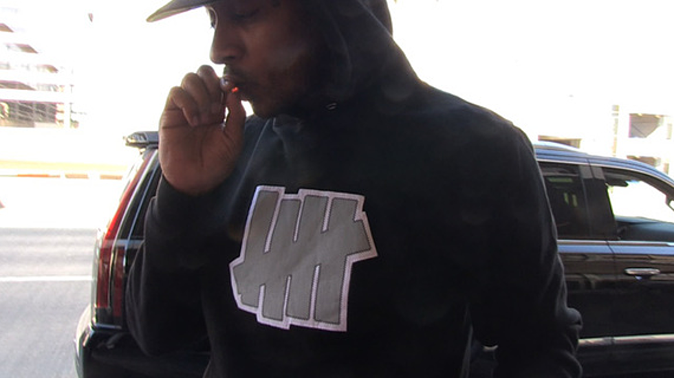 Nipsey Hussle Casually Smokes Weed Walking Into LAX