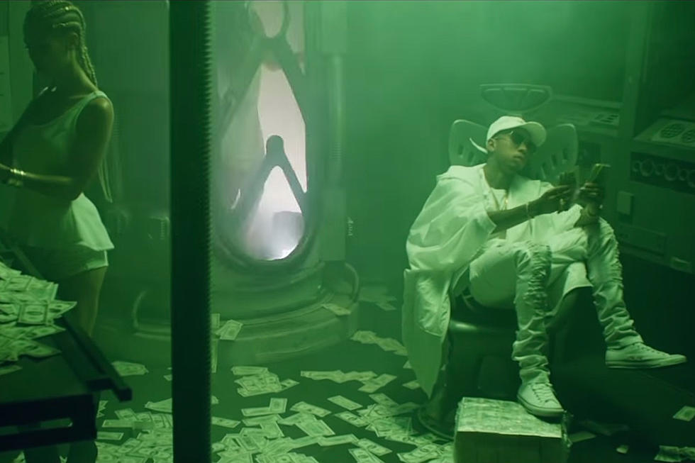 Tyga Is Surrounded by Cash in “Bussin Out the Bag” Video