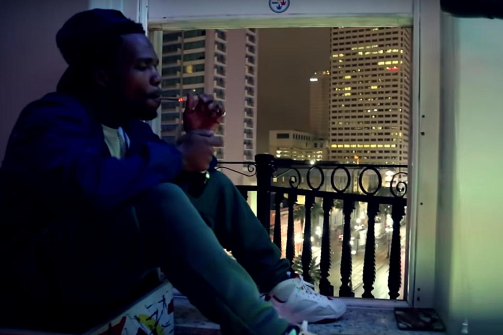 Currensy Lights Up and Rides in "Smoking in the Rain" Video